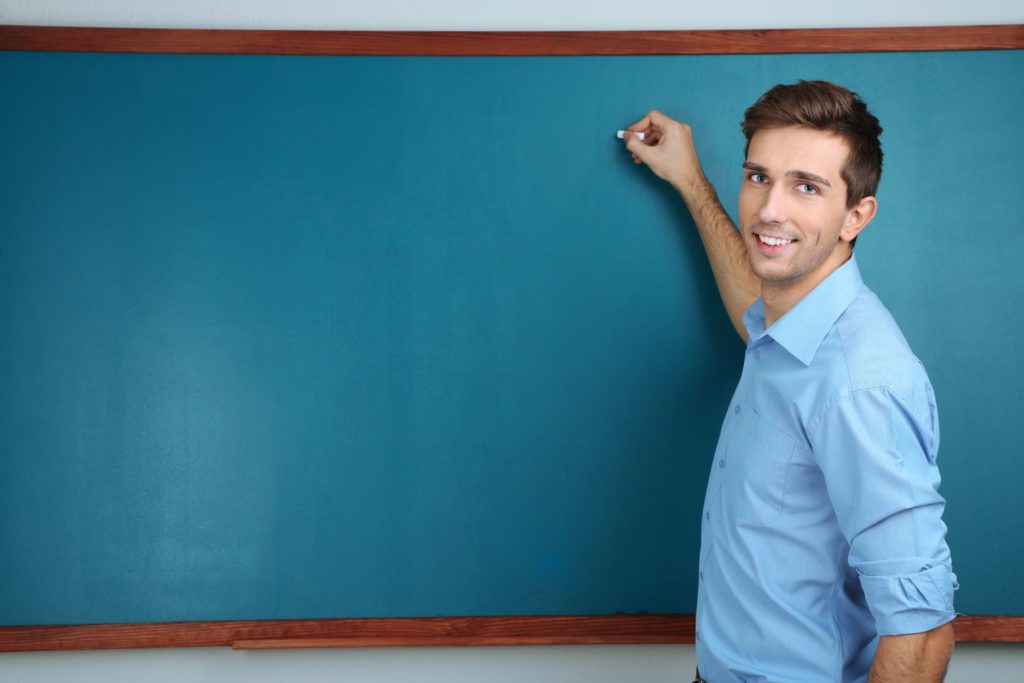 Man teaching at the chalkboard