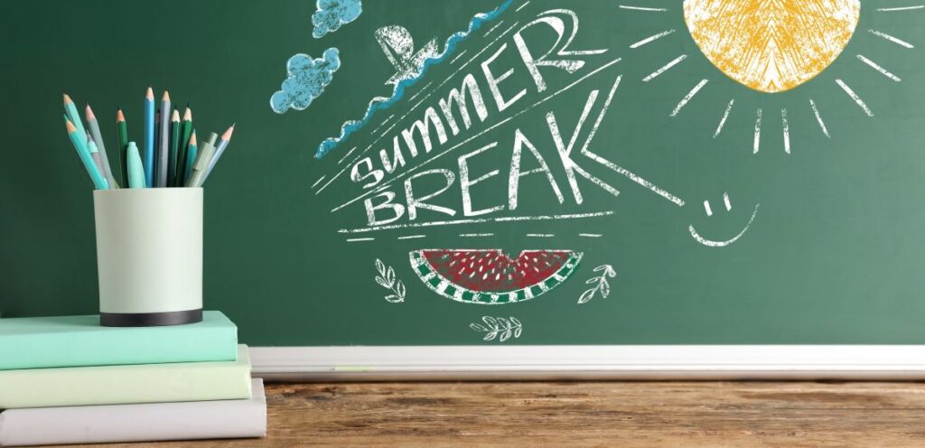 A close-up of a chalkboard with “summer break!” written on it.