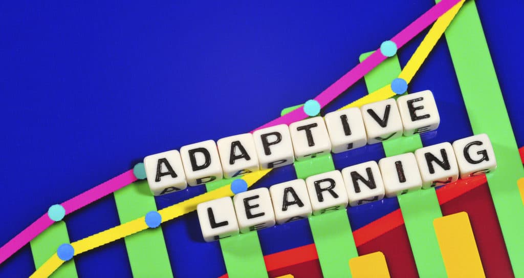 ‘Adaptive Learning’ spelled out in small blocks with a colorful background.