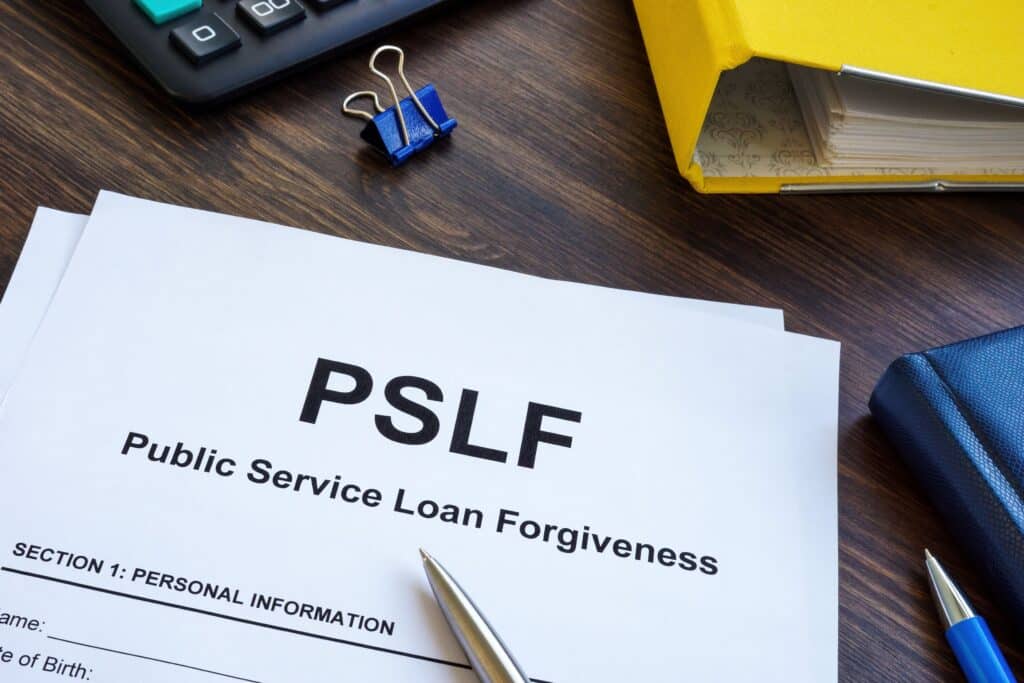 A close-up of a piece of paper that says “public service loan forgiveness.”
