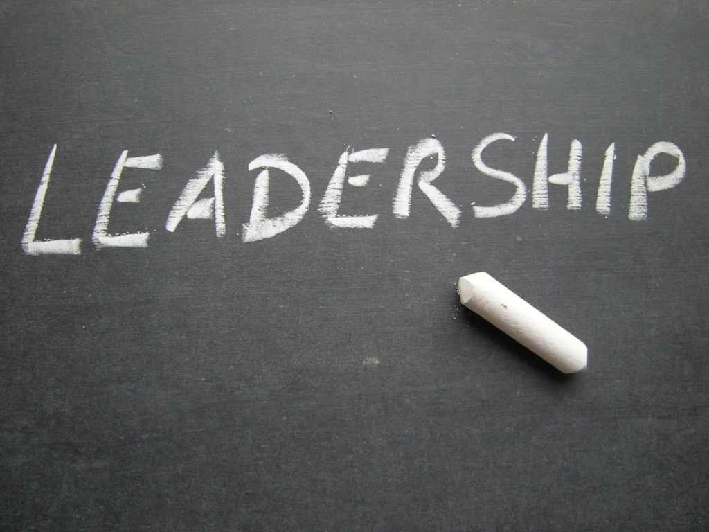 ‘Leadership’ written on a black chalkboard.